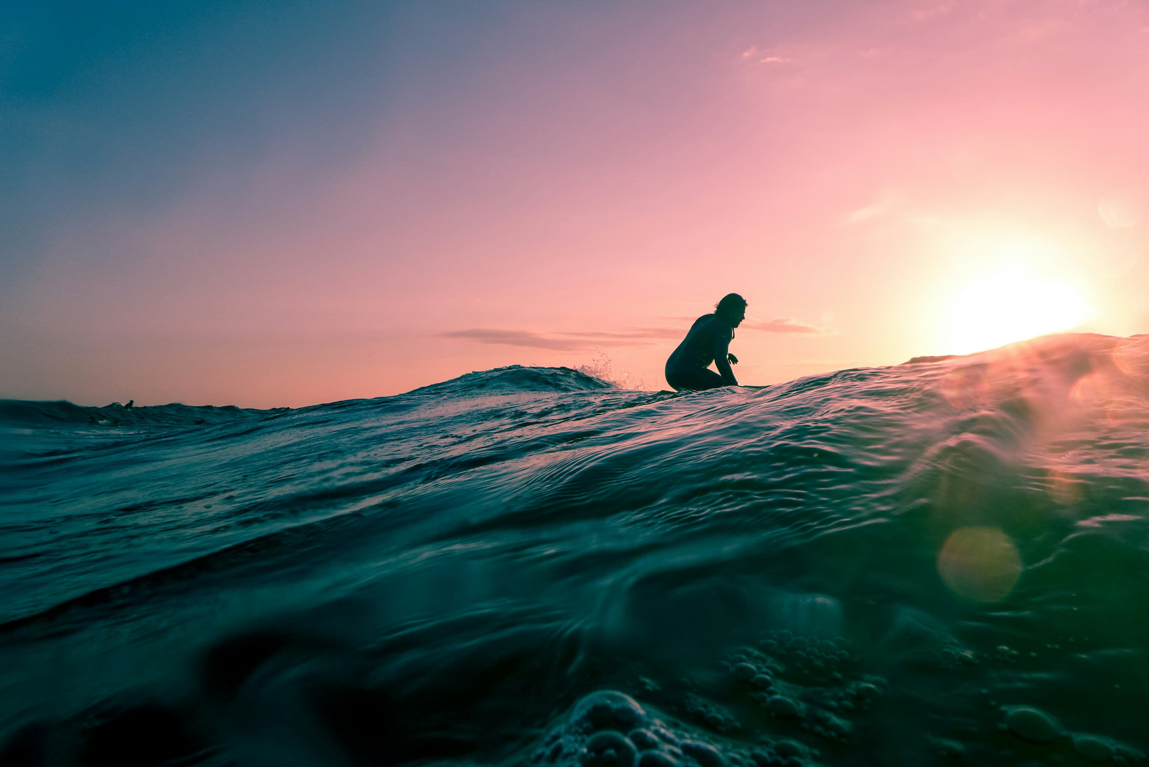Surfing at sunset in Popoyo